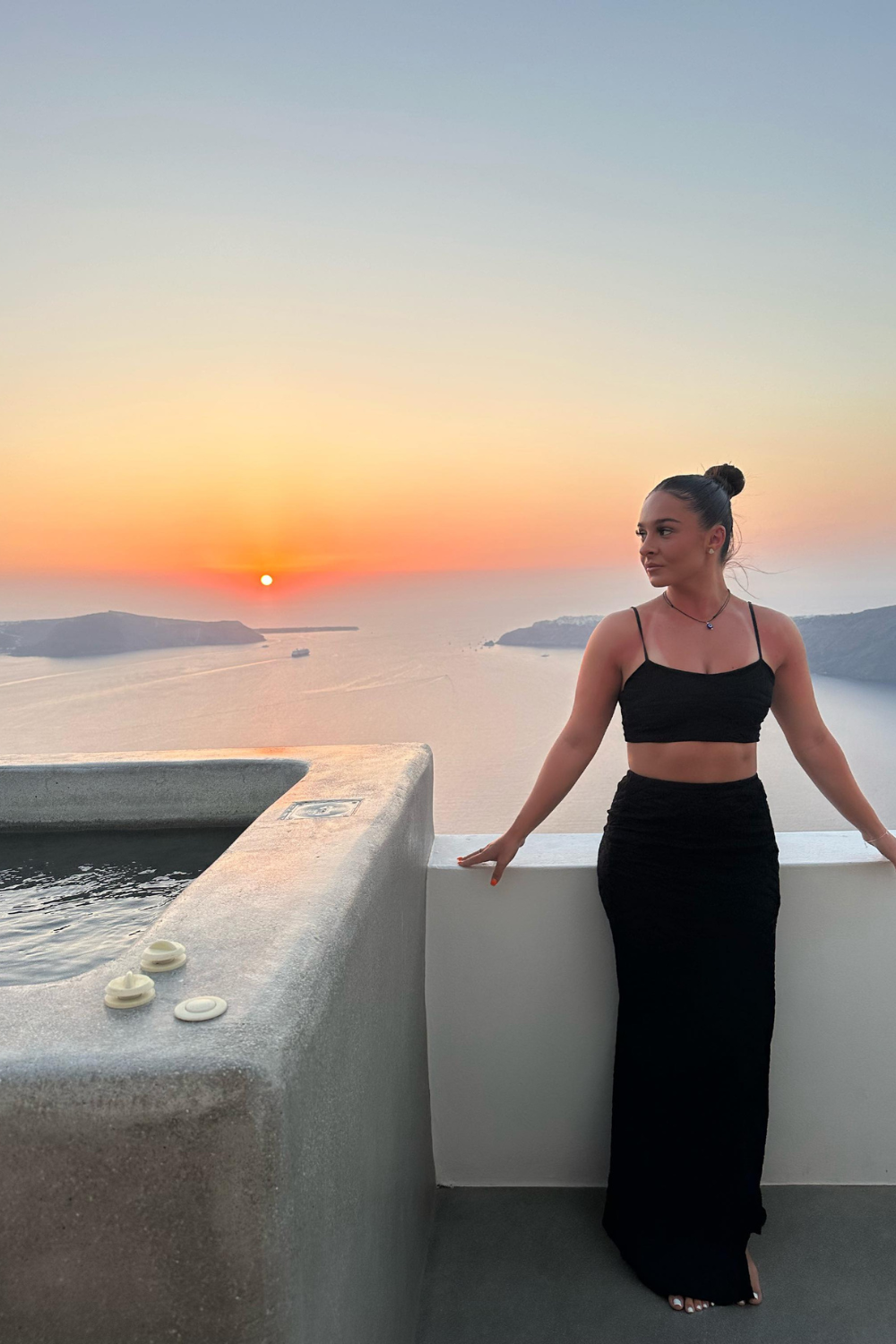 Vaycaze Airlie Set in Black – A sleek and versatile two-piece travel outfit featuring a sweetheart crop top and flowy slit skirt. Perfect for vacations and warm-weather getaways
