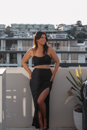 Black Airlie Set by Vaycaze – A must-have suitcase essential with a flattering cropped top and elegant high-slit skirt. Designed for effortless day-to-night styling