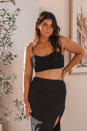 Vaycaze Airlie Set in Black – A sleek and versatile two-piece travel outfit featuring a sweetheart crop top and flowy slit skirt. Perfect for vacations and warm-weather getaways