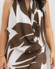 Kaia scarf sarong worn as a scarf, showing the versatile multi-wear design for resortwear and travel outfits.