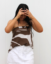 Side view of the Kaia wrap skirt showing the flowy, lightweight fabric and adjustable fit, perfect for travel and beach days.